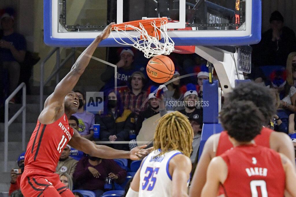 Mark Black Rutgers' Cliff Omoruyi (11) dunks against DePaul during the second half of an NCAA college basketball game Thursday, Nov. 18, 2021, in Chicago. (AP Photo/Mark Black)