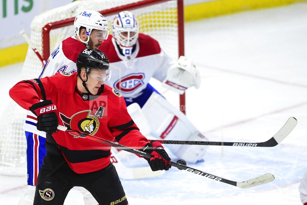 Sean Kilpatrick Ottawa Senators' Brady Tkachuk (7) deflects a shot toward Montreal Canadiens goalie Jake Allen (34) as Canadiens' Joel Edmundson (44) defends during the second period of an NHL hockey game Thursday, April 1, 2021, in Ottawa, Ontario. (Sean Kilpatrick/The Canadian Press via AP)