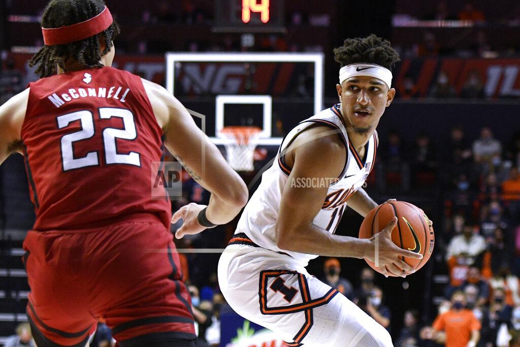 Michael Allio Illinois' Alfonso Plummer (11) is defended by Rutgers' Caleb McConnell during the first half of an NCAA college basketball game Friday, Dec. 3, 2021, in Champaign, Ill. (AP Photo/Michael Allio)