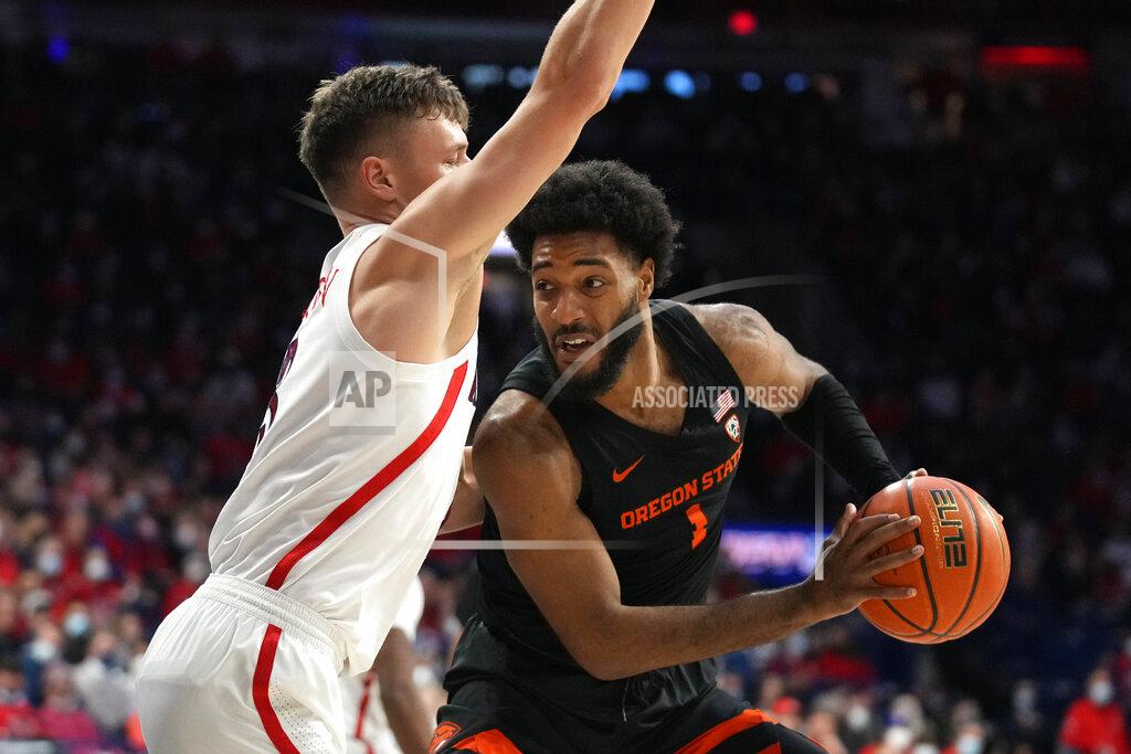 Rick Scuteri Oregon State forward Maurice Calloo, right, drives on Arizona guard Pelle Larsson during the first half of an NCAA college basketball game Thursday, Feb. 17, 2022, in Tucson, Ariz. (AP Photo/Rick Scuteri)