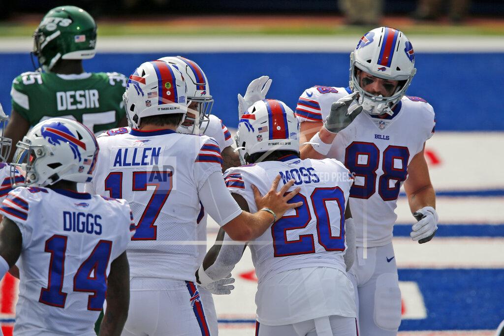 John Munson Buffalo Bills quarterback Josh Allen (17) celebrates with running back Zack Moss (20) after a touchdown during the first half of an NFL football game against the New York Jets in Orchard Park, N.Y., Sunday, Sept. 13, 2020. (AP Photo/John Munson)