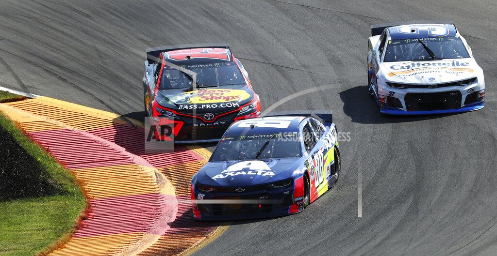 John Munson Alex Bowman (88) holds off Martin Truex, Jr., in Turn 1 during a NASCAR Cup Series auto race at Watkins Glen International, Sunday, Aug. 4, 2019, in Watkins Glen, N.Y. (AP Photo/John Munson)