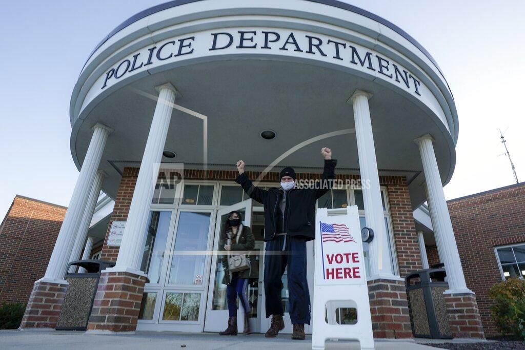 Morry Gash Aaron Warren reacts after voting at the Greendale Police Department on Election Day, Tuesday, Nov. 3, 2020, in Greenfield, Wis. (AP Photo/Morry Gash)
