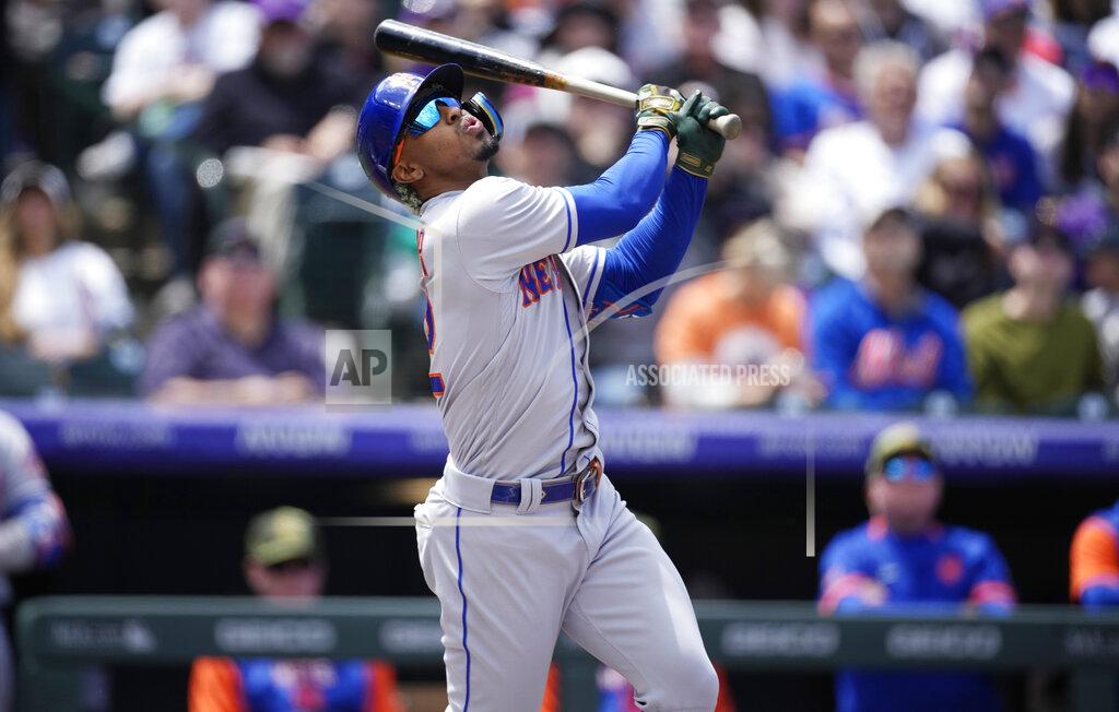 David Zalubowski New York Mets' Francisco Lindor fouls off a pitch from Colorado Rockies starting pitcher Austin Gomber in the first inning of a baseball game Sunday, May 22, 2022, in Denver. (AP Photo/David Zalubowski)