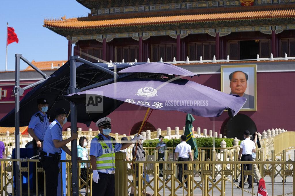 Ng Han Guan Chinese policemen stand on duty near Tiananmen Gate on the 32nd anniversary of a deadly crackdown on pro-democracy protests in Beijing on Friday, June 4, 2021. Commemorations of the June 4, 1989 crackdown on student-led pro-democracy protests centered on Beijing's Tiananmen Square were especially muted Friday amid pandemic control restrictions and increasing political repression. (AP Photo/Ng Han Guan)