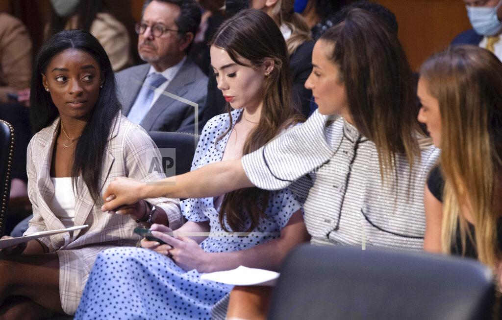 Saul Loeb U.S. gymnasts from left, Simone Biles, McKayla Maroney, Aly Raisman and Maggie Nichols, arrive to testify during a Senate Judiciary hearing about the Inspector General's report on the FBI's handling of the Larry Nassar investigation on Capitol Hill, Wednesday, Sept. 15, 2021, in Washington. Nassar was charged in 2016 with federal child pornography offenses and sexual abuse charges in Michigan. He is now serving decades in prison after hundreds of girls and women said he sexually abused them under the guise of medical treatment when he worked for Michigan State and Indiana-based USA Gymnastics, which trains Olympians. (Saul Loeb/Pool via AP)