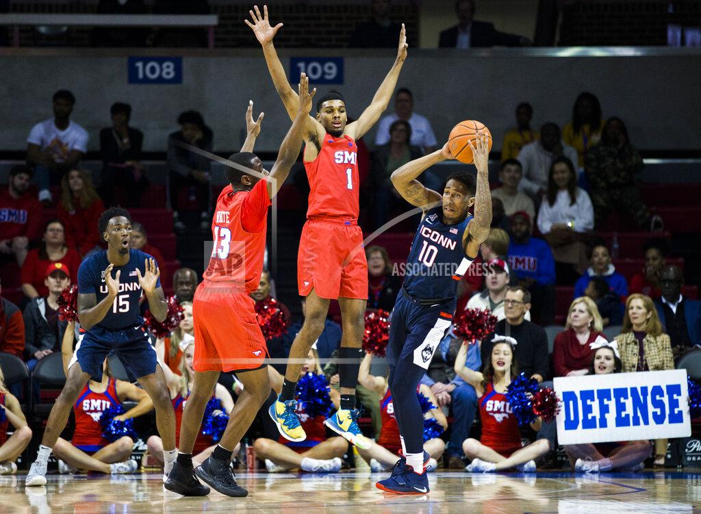 Ashley Landis SMU forward Feron Hunt (1) and guard CJ White (13) defend against Connecticut guard Brendan Adams (10) during the first half of an NCAA college basketball game Wednesday, Feb. 12, 2020, in Dallas. (Ashley Landis/The Dallas Morning News via AP)