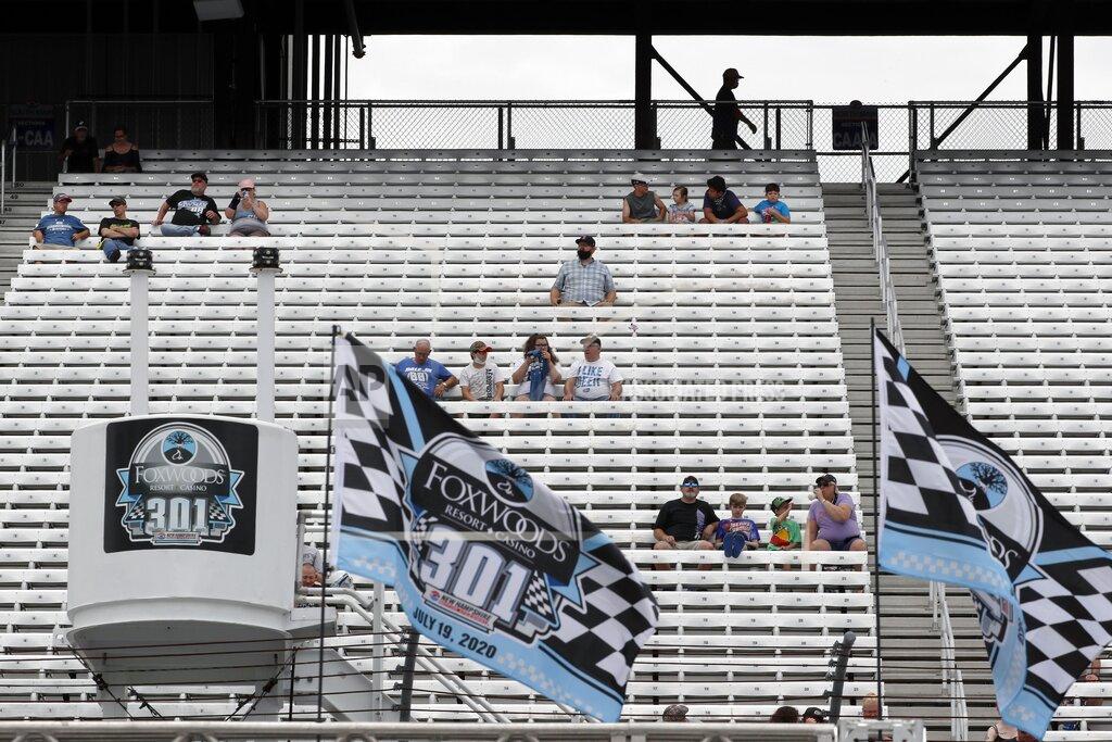 Charles Krupa Fans sit socially distanced due to the coronavirus pandemic in the grandstand before a NASCAR Cup Series auto race, Sunday, Aug. 2, 2020, at the New Hampshire Motor Speedway in Loudon, N.H. (AP Photo/Charles Krupa)