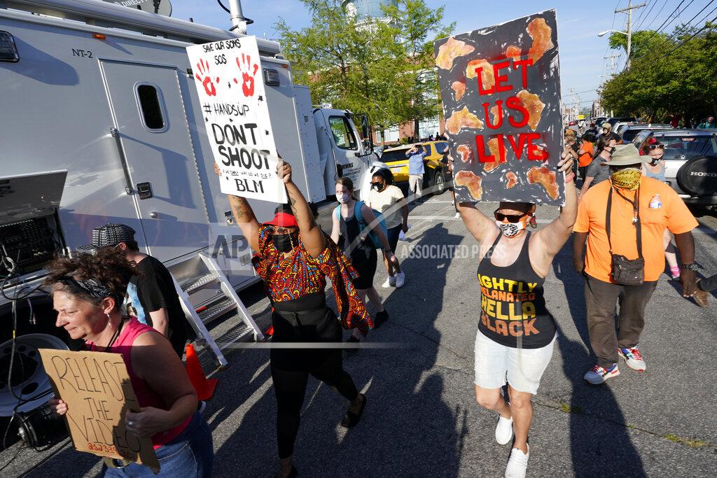 Steve Helber Protesters march along the streets to protest the shooting of Andrew Brown Jr. in Elizabeth City, N.C., Wednesday, April 28, 2021. A judge has denied requests to release body camera video in the case of Brown, a Black man who was killed by North Carolina deputies. (AP Photo/Steve Helber)