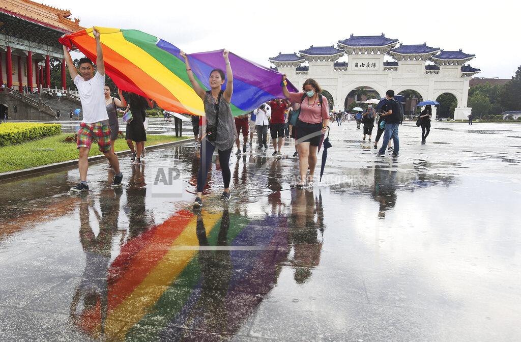 Chiang Ying-Ying Participants march during the "Taiwan Pride March for the World!" at Liberty Square at the CKS Memorial Hall in Taipei, Taiwan, Sunday, June 28, 2020. This year marks the first Gay Pride march in Chicago 1970, and due to the COVID-19 lockdown, Taiwan is one of the very few countries to host the world's only physical Gay Pride. (AP Photo/Chiang Ying-ying)