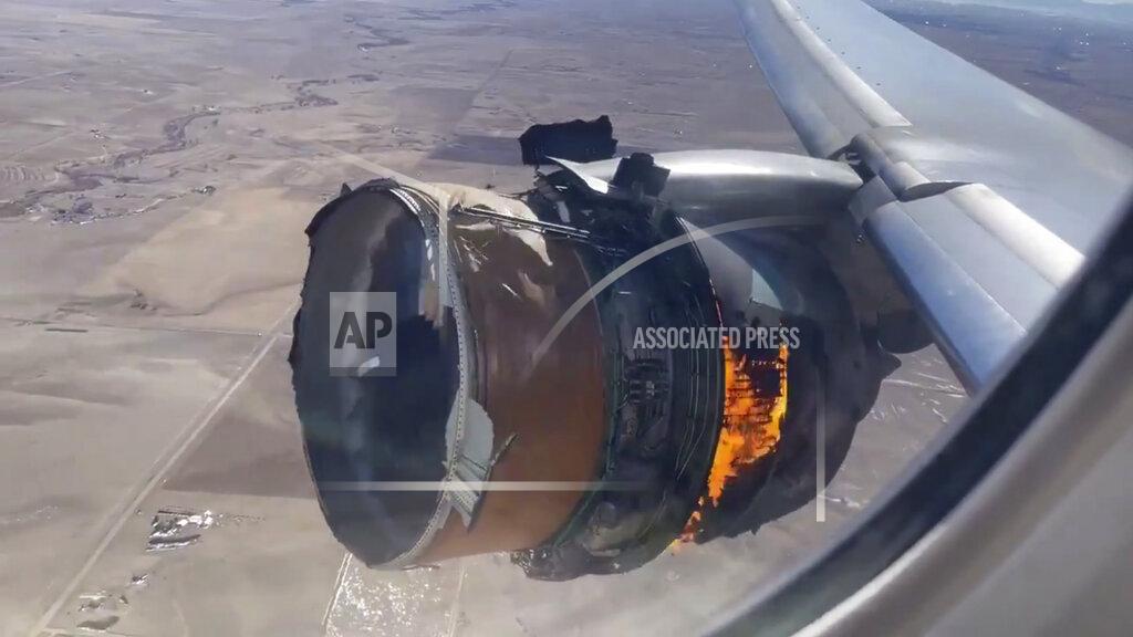 Chad Schnell In this image taken from video, the engine of United Airlines Flight 328 is on fire after after experiencing "a right-engine failure" shortly after takeoff from Denver International Airport, Saturday, Feb. 20, 2021, in Denver, Colo. The flight landed safely and none of the passengers or crew onboard were hurt. (Chad Schnell via AP)