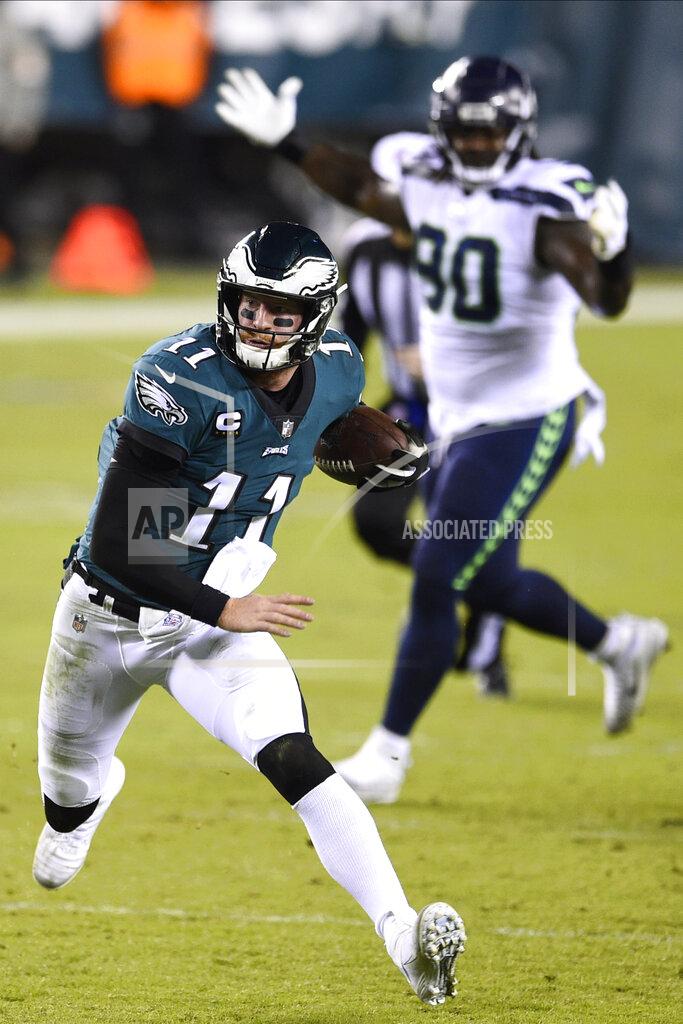 Derik Hamilton Philadelphia Eagles' Carson Wentz scrambles during the first half of an NFL football game against the Seattle Seahawks, Monday, Nov. 30, 2020, in Philadelphia. (AP Photo/Derik Hamilton)