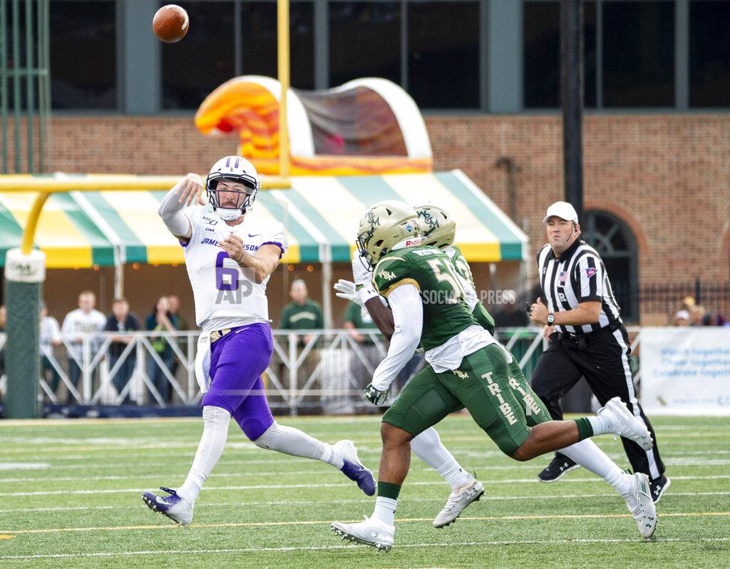 Mike Caudill James Madison quarterback Ben DiNucci (6) is rushed out of the pocket by William & Mary linebackers Trey Watkins (50) and Atman Jones (21) during an NCAA college football game in Williamsburg, Va., on Saturday, Oct. 19, 2019. (Mike Caudill/The Virginian-Pilot via AP)
