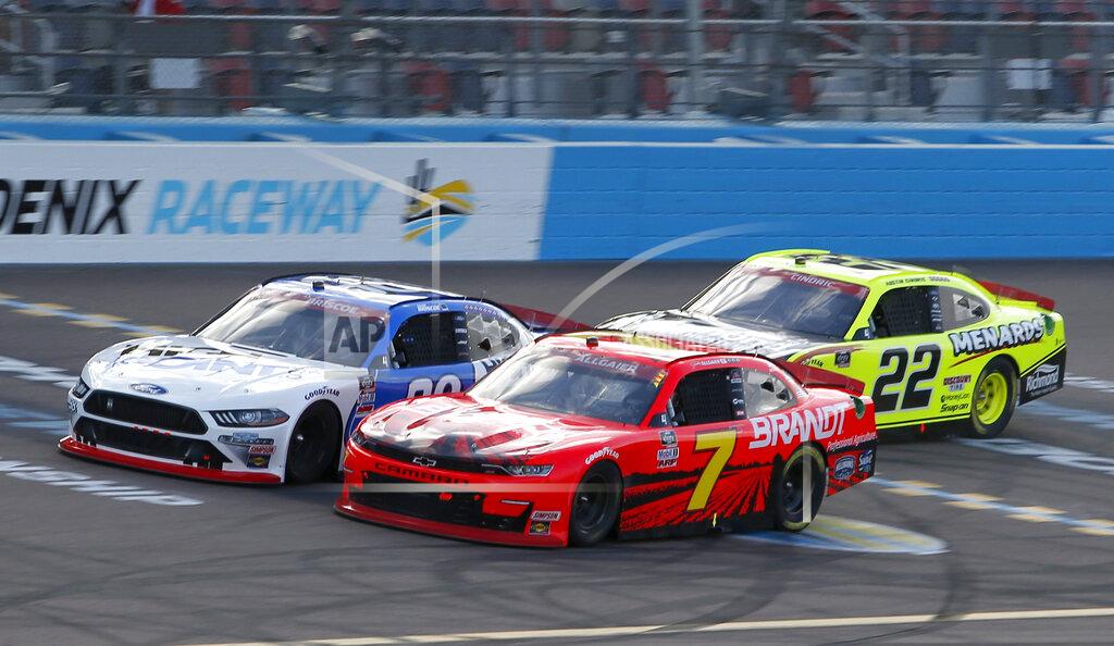 Ralph Freso Justin Allgaier (7) and Chase Briscoe (98) race through Turn 4 ahead of Austin Cindric (22) during a NASCAR Xfinity Series auto race at Phoenix Raceway, Saturday, Nov. 7, 2020, in Avondale, Ariz. (AP Photo/Ralph Freso)