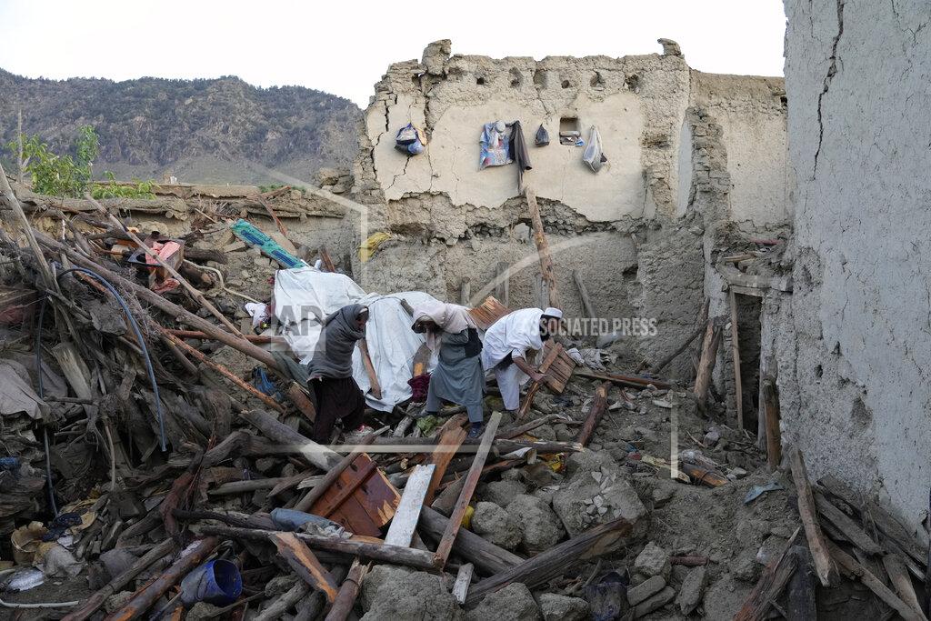 Ebrahim Noroozi Afghans sift through destruction after an earthquake in Gayan village, in Paktika province, Afghanistan, Thursday, June 23, 2022. A powerful earthquake struck a rugged, mountainous region of eastern Afghanistan early Wednesday, flattening stone and mud-brick homes in the country's deadliest quake in two decades, the state-run news agency reported. (AP Photo/Ebrahim Nooroozi)