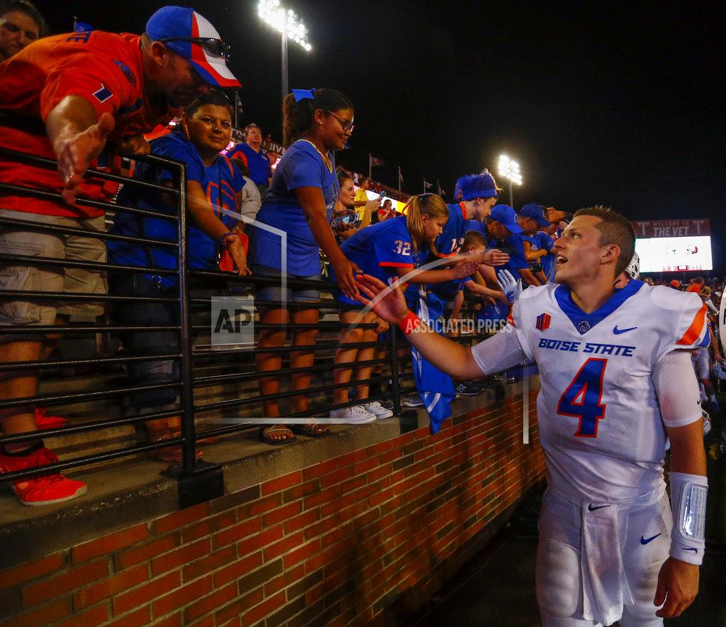 Butch Dill Boise State quarterback Brett Rypien (4) celebrates with fans after defeating Troy in an NCAA college football game, Saturday, Sept. 1, 2018, in Troy, Ala. (AP Photo/Butch Dill)