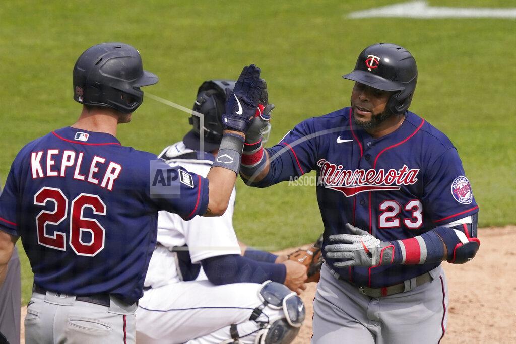 Carlos Osorio Minnesota Twins designated hitter Nelson Cruz (23) is greeted by Max Kepler after a solo home run during the seventh inning of a baseball game against the Detroit Tigers, Tuesday, April 6, 2021, in Detroit. (AP Photo/Carlos Osorio)