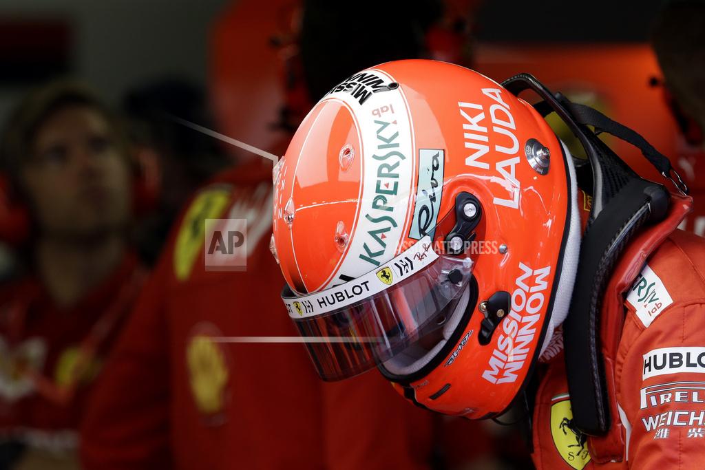 Luca Bruno The name of three-time Formula One world champion Niki Lauda is written on the helmet of Ferrari driver Sebastian Vettel of Germany during the second practice session at the Monaco racetrack, in Monaco, Thursday, May 23, 2019. Three-time Formula One world champion Niki Lauda, who won two of his titles after a horrific crash that left him with serious burns and went on to become a prominent figure in the aviation industry, has died on May 21, 2109. He was 70. (AP Photo/Luca Bruno)