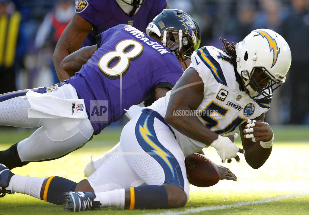 Carolyn Kaster Baltimore Ravens quarterback Lamar Jackson, left, and Los Angeles Chargers defensive end Melvin Ingram chase after possession of a fumble in the first half of an NFL wild card playoff football game, Sunday, Jan. 6, 2019, in Baltimore. Baltimore recovered the ball on the play. (AP Photo/Carolyn Kaster)