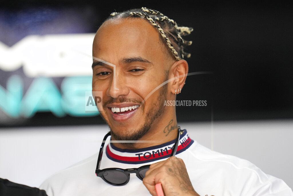 Manu Fernandez Mercedes driver Lewis Hamilton, of Britain, smiles at pit prior to the start of the first practice for the French Formula One Grand Prix at Paul Ricard racetrack in Le Castellet, southern France, Friday, July 22, 2022. The French Grand Prix will be held on Sunday. (AP Photo/Manu Fernandez)