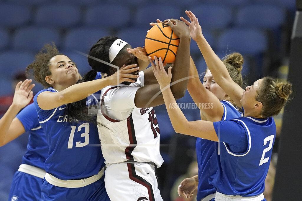 Gerry Broome South Carolina forward Laeticia Amihere (15) is pressured by Creighton guard Rachael Saunders (13), guard Tatum Rembao (2) and guard Morgan Maly, rear, during the first half of a college basketball game in the Elite 8 round of the NCAA tournament in Greensboro, N.C., Sunday, March 27, 2022. (AP Photo/Gerry Broome)