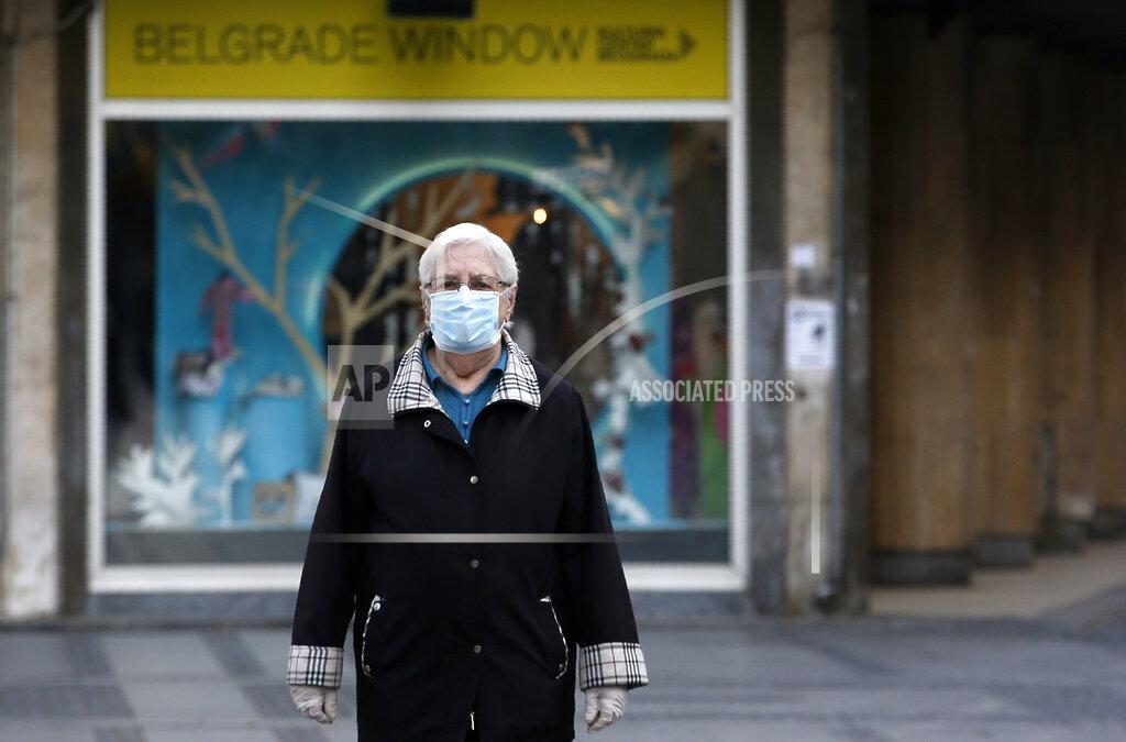 Darko Vojinovic An elderly woman wearing a mask against the spread of the new coronavirus walks during a curfew in downtown Belgrade, Serbia, Tuesday, April 21, 2020. Serbia's elderly on Tuesday ventured outside their homes for the first time in more than a month as the authorities eased some of the strict measures that have been in place against the new coronavirus. Serbia has introduced some of the toughest rules in Europe as part of efforts to curb the spread of the virus. (AP Photo/Darko Vojinovic)