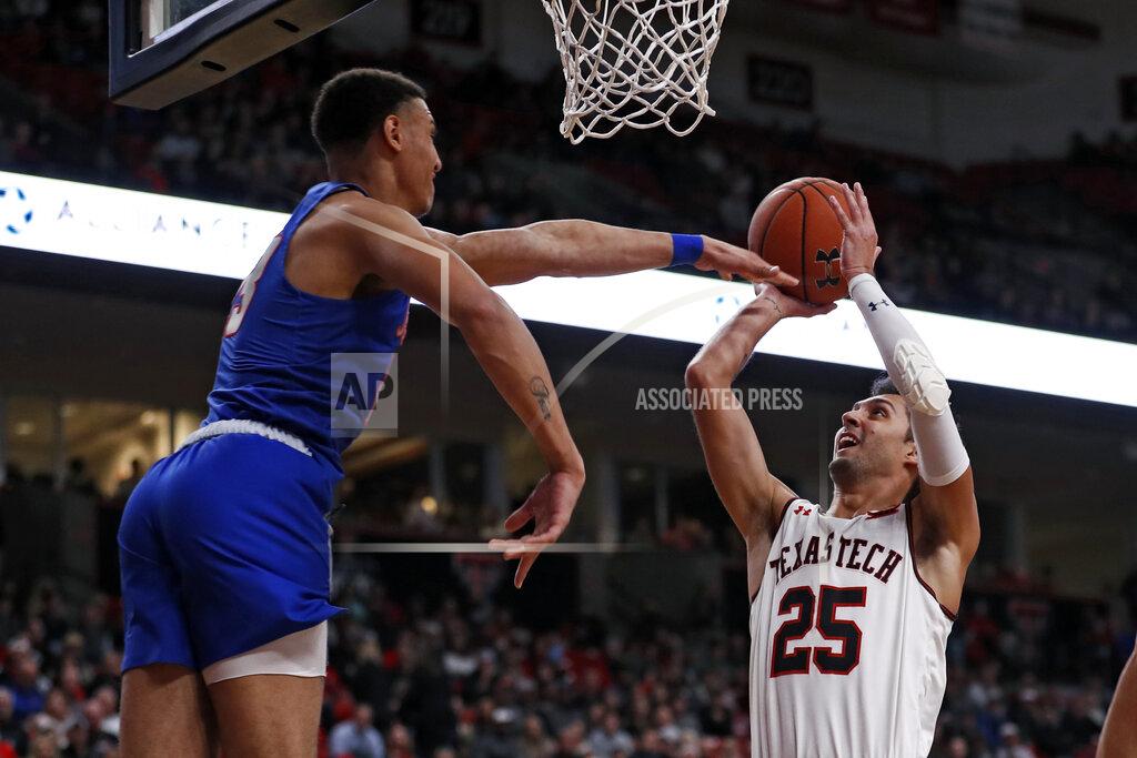 Brad Tollefson Texas Tech's Davide Moretti (25) shoots the ball around Tennessee State's Ravel Moody (23) during the second half of an NCAA college basketball game Thursday, Nov. 21, 2019, in Lubbock, Texas. (AP Photo/Brad Tollefson)