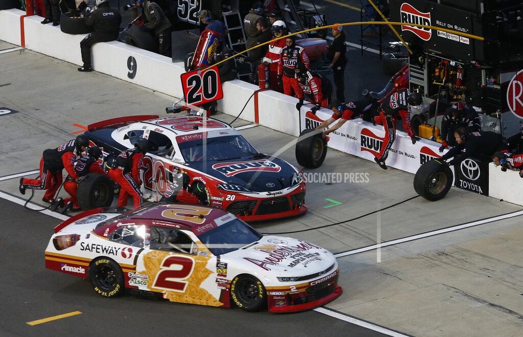 Steve Helber Tyler Reddick (2) heads into the pits as Christopher Bell (20) makes a pits stop during the NASCAR Xfinity Series auto race at Richmond Raceway in Richmond, Va., Friday, April 12, 2019. (AP Photo/Steve Helber)