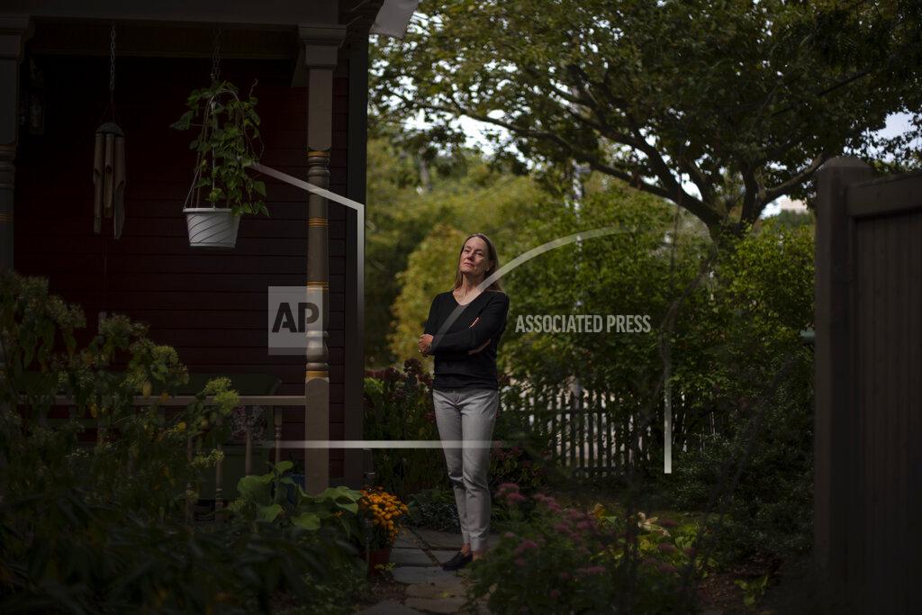 David Goldman Charlotte Breed Handy, 57, a direct descendant of a Pilgrim who came over on the Mayflower, stands for a portrait outside her home in Providence, R.I., Tuesday, Sept. 22, 2020. "When I look back on my ancestry to the Mayflower, I do feel a little bit of ambivalence about it. But I also have a sense of pride about it from that side of my family, my dad's side. But I do feel like there's so much left out in terms of history when you follow a patriarchal line back. You're leaving out all the women that were pulled along the way," said Breed Handy. "I think that while it's good to take pride in your own culture and your own, whatever your feeling part of that, you're careful to respect other people's realities and cultures and way of being in the world, because there are a lot of different ways to be in the world." (AP Photo/David Goldman)