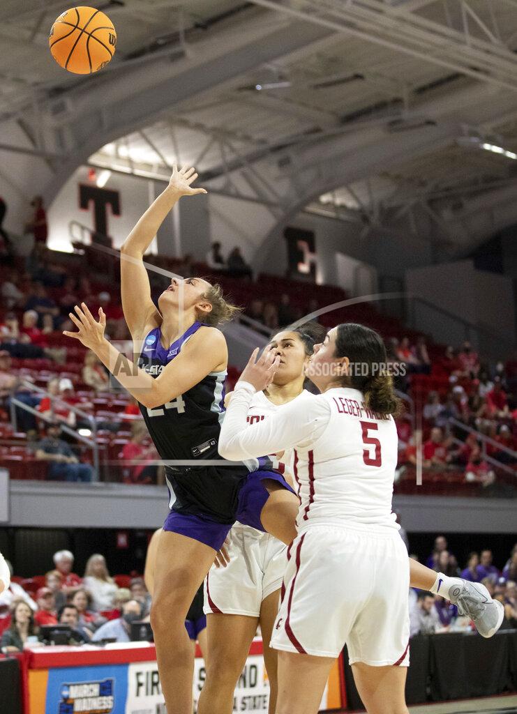 Ben Mckeown Kansas State's Emilee Ebert (24) attempts a shot between Washington State's Charlisse Leger-Walker (5) and Ula Motuga during the first half of a college basketball game in the first round of the NCAA tournament in Raleigh, N.C., Saturday, March 19, 2022. (AP Photo/Ben McKeown)