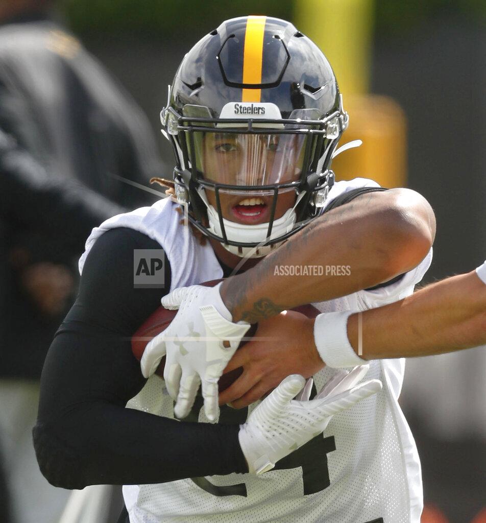 Keith Srakocic FILE - This May 21, 2019, file photo shows Pittsburgh Steelers rookie running back Benny Snell Jr. performing drills during an NFL football practice in Pittsburgh. Teammate James Conner is now entrenched as the starter entering his third season, but welcomes the chance to share the load with Jaylen Samuels and Snell. (AP Photo/Keith Srakocic, File)