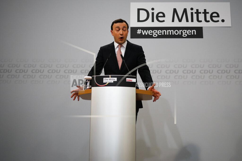 Markus Schreiber Christian Democratic Union party, CDU, Secretary General Paul Ziemiak holds a statement after projections of the regional election in federal German states Baden Wuerttemberg and Rhineland-Palatinate was announced at the party's headquarters in Berlin, Germany, Sunday, March 14, 2021. The background reads: 'The Center #because tomorrow'. (AP Photo/Markus Schreiber, Pool)