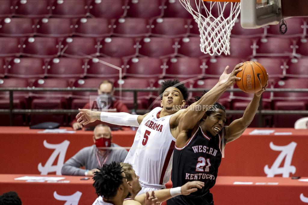 Vasha Hunt Alabama guard Jaden Shackelford (5) pressures Western Kentucky guard Kenny Cooper (21) as Cooper rebounds the ball during the second half of an NCAA college basketball game, Saturday, Dec. 19, 2020, in Tuscaloosa, Ala. (AP Photo/Vasha Hunt)