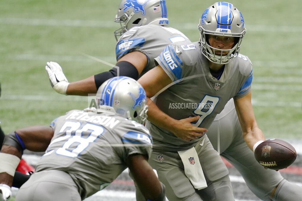 Brynn Anderson Detroit Lions quarterback Matthew Stafford (9) hands the ball off to Detroit Lions running back Adrian Peterson (28) against the Atlanta Falcons during the first half of an NFL football game, Sunday, Oct. 25, 2020, in Atlanta. (AP Photo/Brynn Anderson)