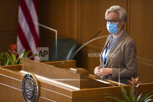 Oregon State House Speaker Tina Kotek addresses representatives before adjourning due to someone testing positive for COVID-19, Tuesday, Sept. 21, 2021, during a special legislative session for redistricting congressional maps at the Oregon State Capitol in Salem, Ore. (Brian Hayes/Statesman-Journal via AP)