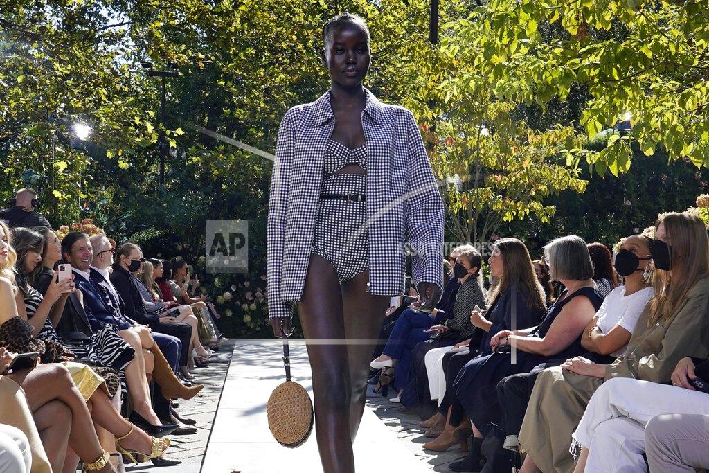 Richard Drew The Michael Kors Spring/Summer 2022 collection is modeled during Fashion Week, in New York, Friday, Sept. 10, 2021. (AP Photo/Richard Drew)