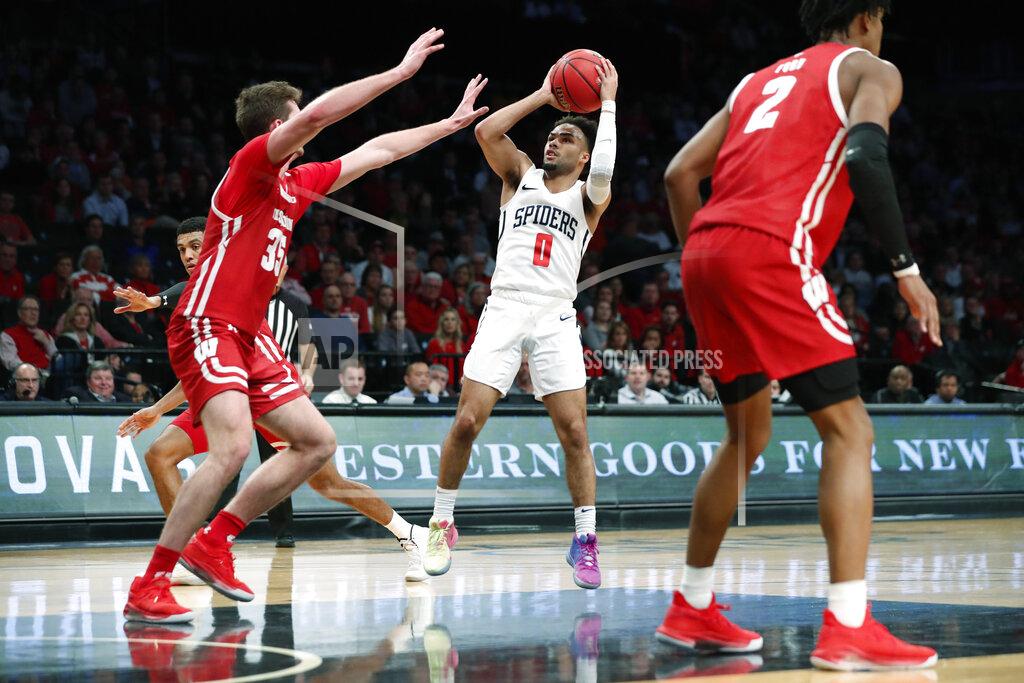 Kathy Willens Wisconsin forward Nate Reuvers (35) defends as Richmond guard Jacob Gilyard (0) takes a shot during the second half of an NCAA college basketball game in the Legends Classic, Monday, Nov. 25, 2019, in New York. Richmond defeated Wisconsin 62-52. (AP Photo/Kathy Willens)