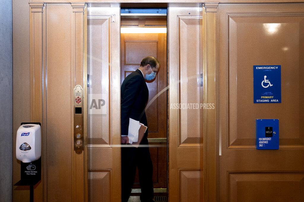Stefani Reynolds Sen. Ron Wyden, D-Ore., gets into a elevator on Capitol Hill after the Senate acquitted former President Donald Trump in his second impeachment trial in the Senate at the U.S. Capitol in Washington, Saturday, Feb. 13, 2021. (Stefani Reynolds/Pool via AP)
