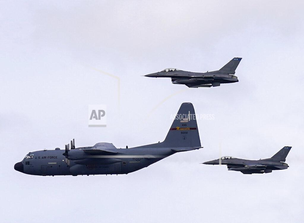 A pair of F-16 Fighting Falcon aircraft from the 148th Fighter Wing out of Duluth flanked a C-130 Hercules aircraft from the 133rd Air Wing out of Fort Snelling as it flew south from downtown Minneapolis, Wednesday, May 6, 2020, to honor frontline health care workers. The Minnesota National Guard conducted flyovers across the state to recognize the frontline health care workers of the COVID-19 pandemic response. (Jeff Wheeler/Star Tribune via AP)