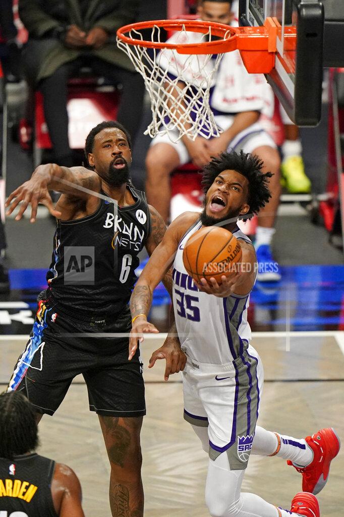 Kathy Willens Brooklyn Nets center DeAndre Jordan (6) defends Sacramento Kings forward Marvin Bagley III (35) as Bagley goes up for a layup during the first quarter of an NBA basketball game, Tuesday, Feb. 23, 2021, in New York. (AP Photo/Kathy Willens)