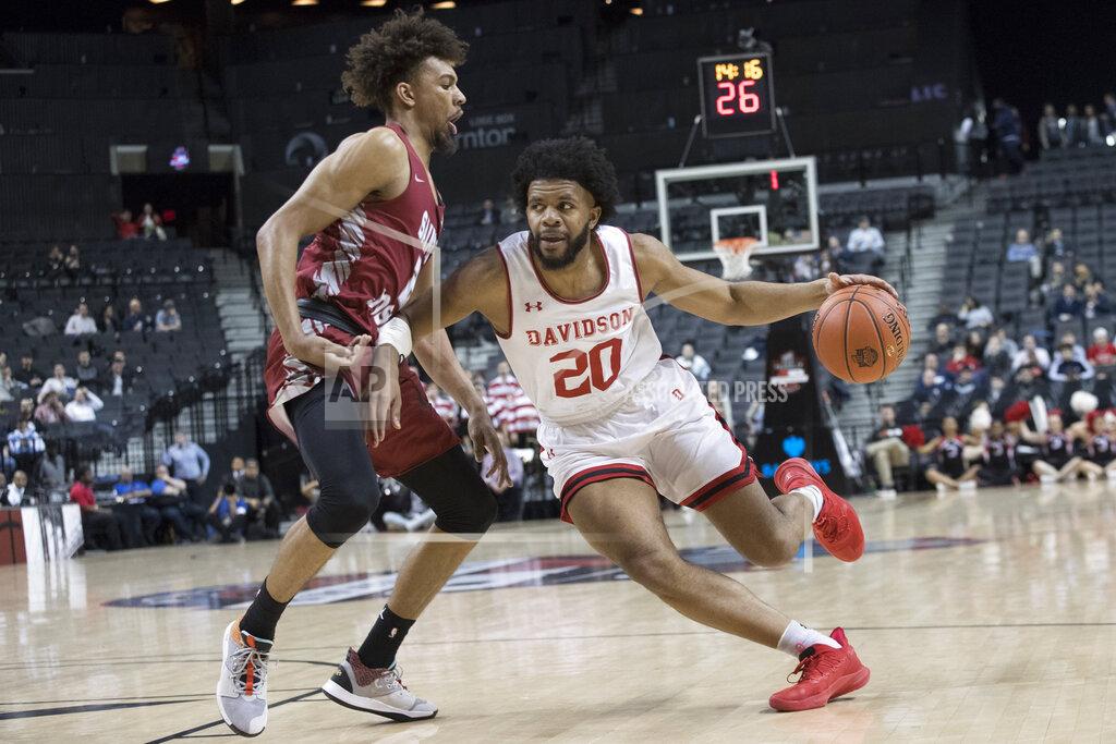 Mary Altaffer Davidson guard KiShawn Pritchett (20) drives to the basket against Saint Joseph's forward Charlie Brown Jr. (2) during the first half of an NCAA college basketball game in the Atlantic 10 Conference tournament, Friday, March 15, 2019, in New York. (AP Photo/Mary Altaffer)