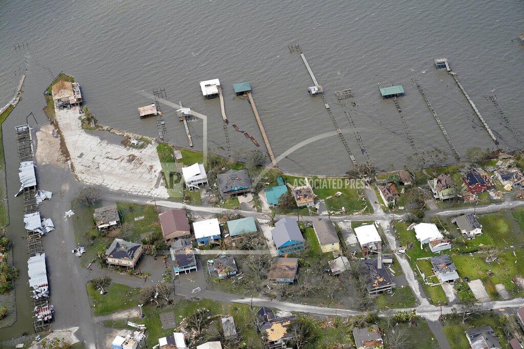 David J. Phillip Buildings and homes are damaged in the aftermath of Hurricane Laura Thursday, Aug. 27, 2020, near Lake Charles, La. (AP Photo/David J. Phillip)