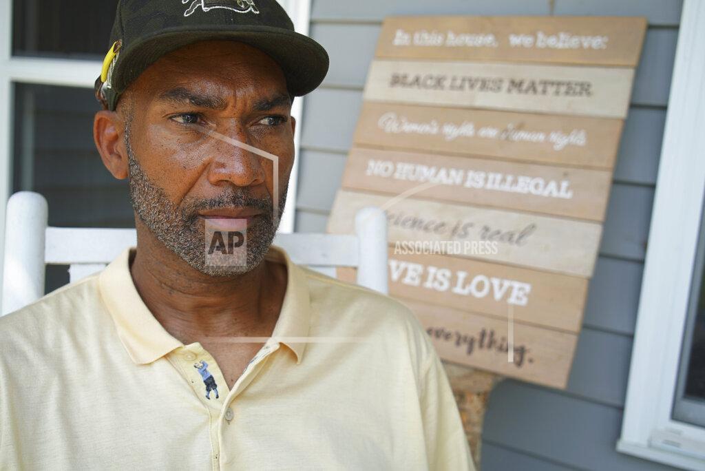 Allen G. Breed Alton Lucas sits on the porch of his home outside of Raleigh, N.C., on Friday, June 18, 2021. As a teenager, Alton Lucas believed basketball or music would pluck him out of North Carolina and take him around the world. In the late 1980s, he was already the right-hand man to his musically inclined best friend, Youtha Anthony Fowler, who many hip hop and R&B heads know today as DJ Nabs. (AP Photo/Allen G. Breed)