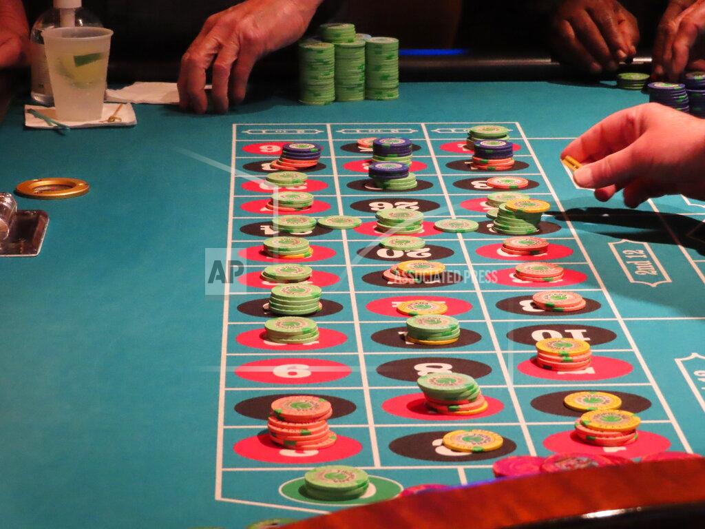 Wayne Parry Gamblers place their bets during a roulette game at the Tropicana casino in Atlantic City, N.J., on May 12, 2022. Figures released by New Jersey gambling regulators on May 23, 2022, show the Atlantic City casinos collectively posted a gross operating profit of $155.6 million in the first quarter of this year. (AP Photo/Wayne Parry)