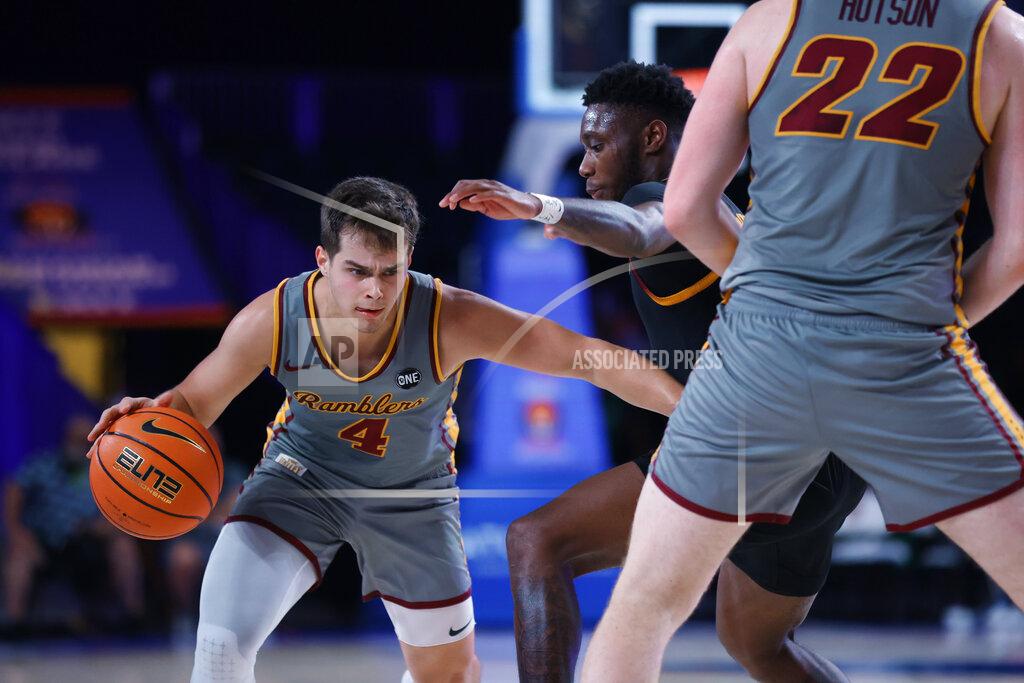 Tim Aylen In a photo provided by Bahamas Visual Services, Loyola Chicago guard Braden Norris (4) drives on Arizona State's Jay Heath during an NCAA college basketball game at Paradise Island, Bahamas, Friday, Nov. 26, 2021. (Tim Aylen/Bahamas Visual Services via AP)