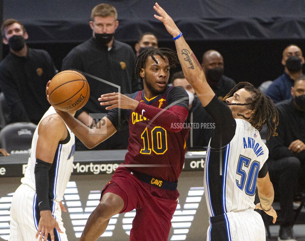 Phil Long Cleveland Cavaliers' Darius Garland (10) tries to pass around Orlando Magic's Cole Anthony (50) during the fourth quarter of an NBA basketball game Wednesday, April 28, 2021 in Cleveland. The Magic won 109-104. (AP Photo/Phil Long)