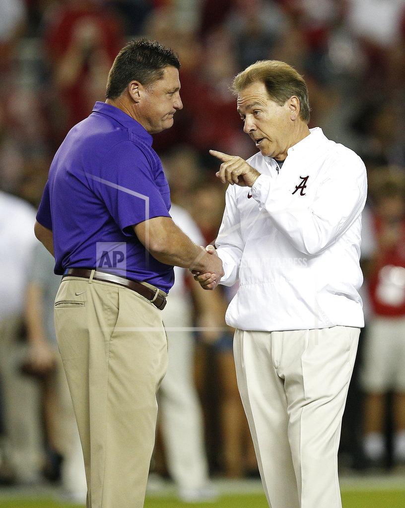 Brynn Anderson FILE - In this Nov. 4, 2017, file photo, Alabama head coach Nick Saban, right, and LSU head coach Ed Orgeron, left, meet in the center of the field before an NCAA college football game, in Tuscaloosa, Ala. Alabama and LSU face off on Saturday in Baton Rouge, La. (AP Photo/Brynn Anderson, File)
