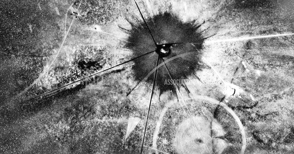 Uncredited FILE - This July 16, 1945 photo, shows an aerial view after the first atomic explosion at Trinity Test Site, N.M. A defense spending bill pending in Congress includes an apology to New Mexico, Nevada, Utah and other states affected by nuclear testing over the decades, but communities downwind from the first atomic test in 1945 are still holding out for compensation amid rumblings about the potential for the U.S. to resume nuclear testing. (AP Photo/File)