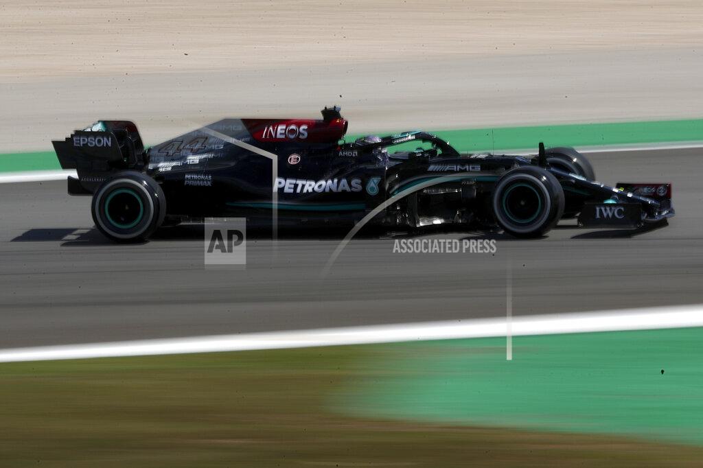 Manu Fernandez Mercedes driver Lewis Hamilton of Britain steers his car during the first free practice session ahead of the Portugal Formula One Grand Prix at the Algarve International Circuit near Portimao, Portugal, Friday, April 30, 2021. The Portugal Grand Prix will be held on Sunday. (AP Photo/Manu Fernandez)