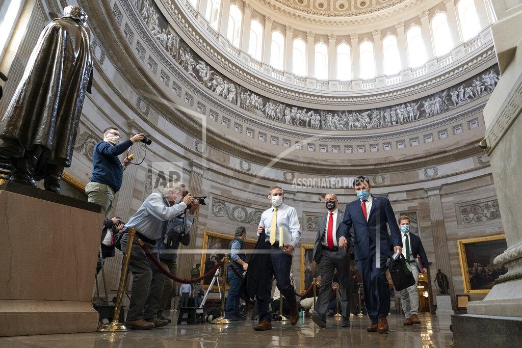 Alex Brandon Rep. Jim Jordan, R-Ohio, left, and others walk through the Rotunda to the Senate for the second impeachment trial of former President Donald Trump, Tuesday, Feb. 9, 2021, in Washington. (AP Photo/Alex Brandon)